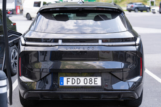 August 17, 2026, Gudvangen, Norway - Rear view of a black Lynk & Co car with a Swedish license plate at a charging station