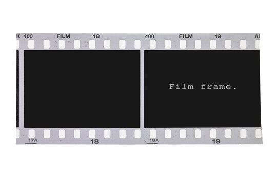 Retro 35mm photographic film negative strip close up with two empty frames isolated.