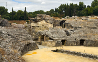 Obraz premium The arena in the amphitheater of Italica, an archaeological site at the outskirts of Seville 