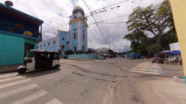 Calima el Darien town street with church and tuk-tuk in colombia