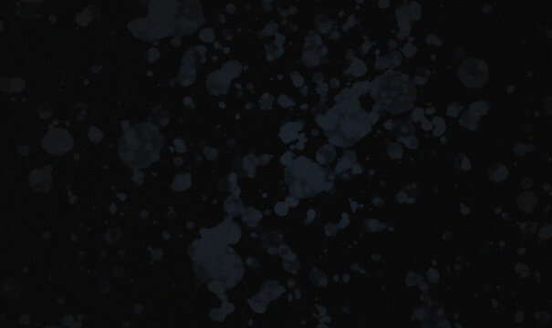 Abstract Dark Background with Faded White Speckles and Soft Out of Focus Circular Light Blobs