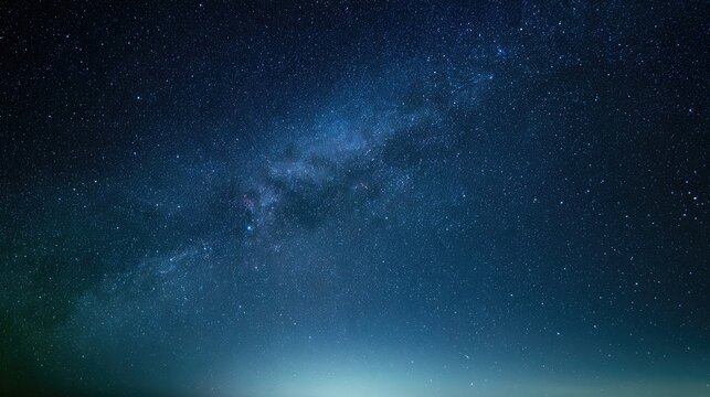 A clear night sky reveals the vast, glowing Milky Way galaxy