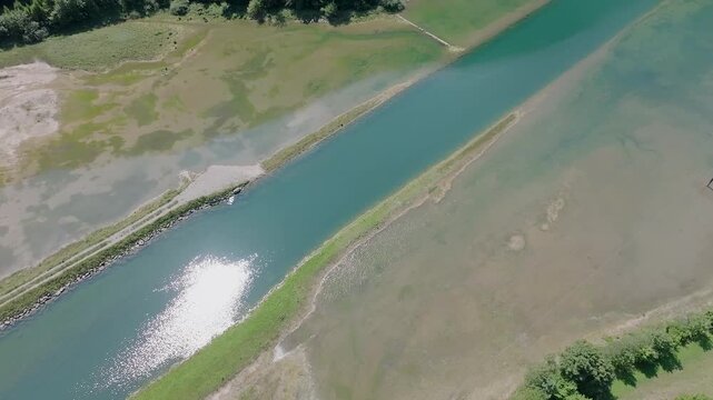 Drone Flight Over a Mountain River and Forest in Stoos