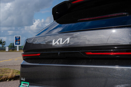 August 21, 2026, Amsterdam, Netherlands - Rear view of a dark grey Kia K4 car with Kia and Enterprise logos