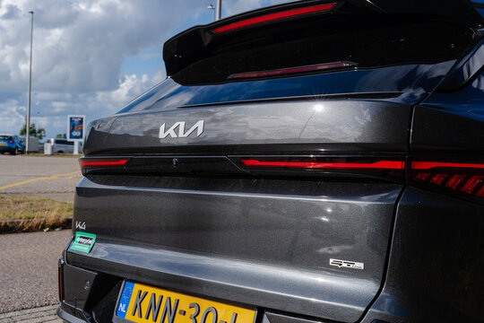 August 21, 2026, Amsterdam, Netherlands - Rear view of a dark grey Kia K4 GT Line car with Enterprise Rent-A-Car sticker