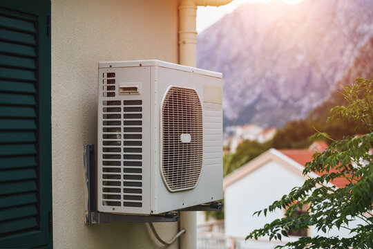 HVAC cooling heating unit fixed on exterior of house