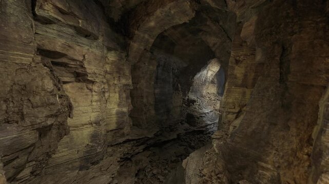 Narrow corridor leading toward distant light with layered rock shelves and deep shadows, sense of movement and anticipation for exploration or dramatic travel