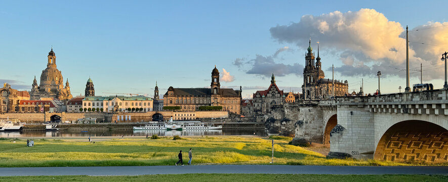 Landscape of historical buildings along the river at sunset in Dresden, Germany 