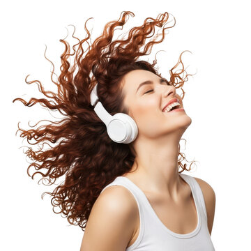 Woman laughing with headphones while enjoying music