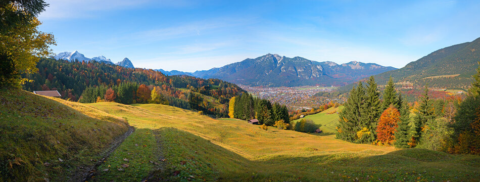 autumnal alpine landscape panorama. view over meadow to Kramer mountain and Garmisch