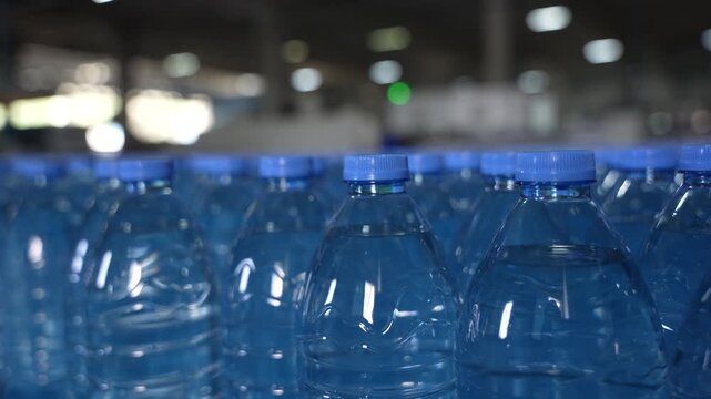 Close-Up of Plastic Water Bottles in Bottling Factory