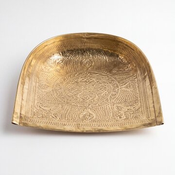 Traditional brass Soop tray for Chhath Puja ritual isolated on white background