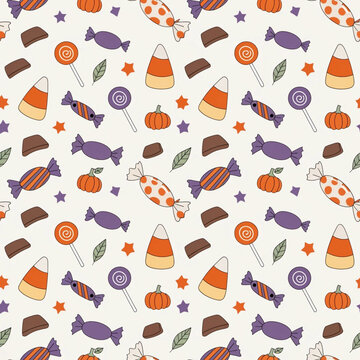 Colorful Halloween candy pattern with sweets, pumpkins, stars and autumn leaves.