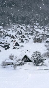 Snowfall in Shirakawago village in winter, UNESCO world heritage sites, Japan. Vertical.