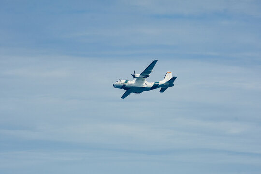 CN-235MP maritime patrol aircraft operated by the Spanish Civil Guard Air Service flying against a cloudy blue sky during an aviation demonstration in Gij&oacute;n, Asturias, Spain.