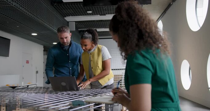 Business People Working and Collaborating in Around a Table in Modern Office