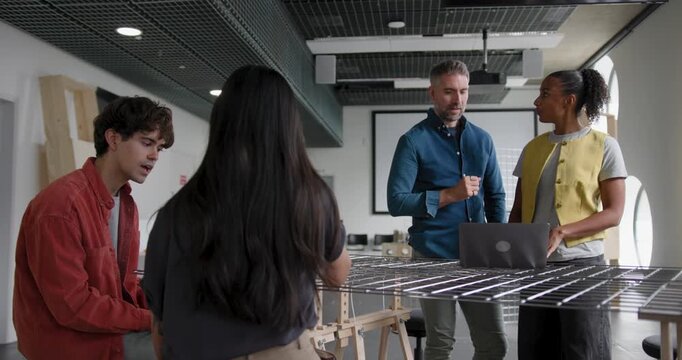 Business People Working and Collaborating in Around a Table in Modern Office