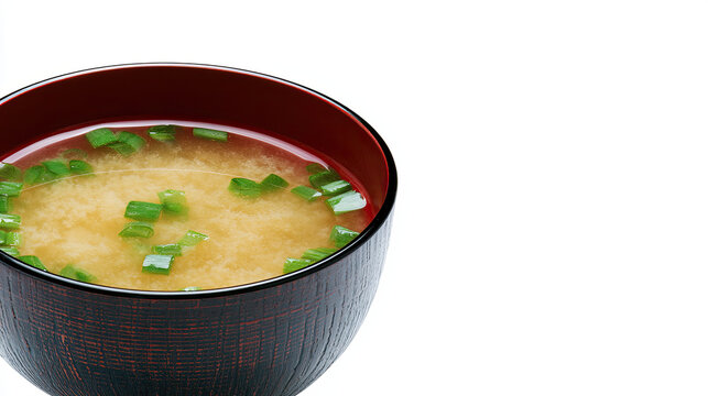 transparent bowl of miso soup on white background