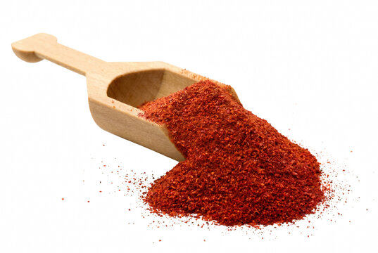 Vibrant Red Paprika Powder Spilled from a Wooden Scoop