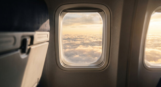 airplane window view clouds sunset