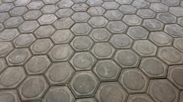 High angle view of hexagonal concrete paving blocks pattern on walkway