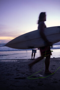 Surfers near the ocean