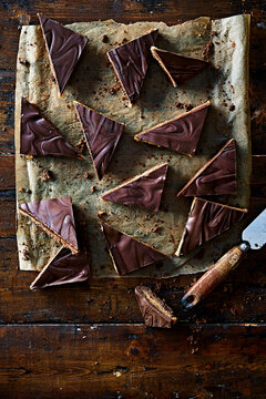 Chocolate Caramel Shortbread Triangles with Marbled Chocolate on Rustic Wooden Table