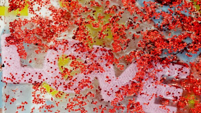 The word love with felt and glitter 
