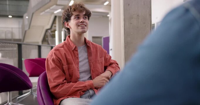 Engaging Interview with a with Two Businessmen in Open Plan Modern Office