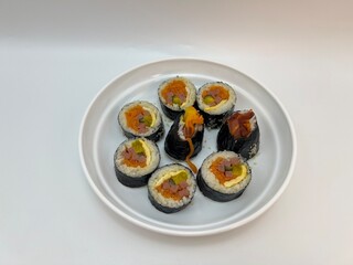 Top view of Japanese sushi rolls with rice, seaweed and colorful filling arranged  © Nawn