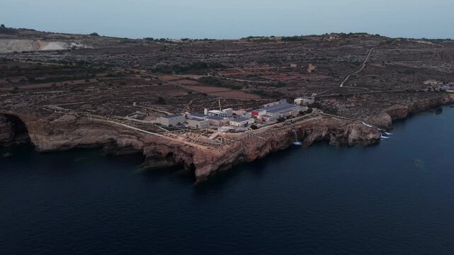 Drone shot of coastal desalination plant in Ghar Lapsi Malta