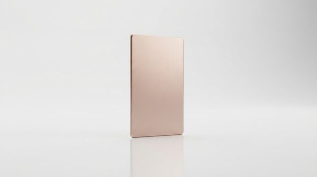 A single blank rose gold metal card standing upright on a clean white background