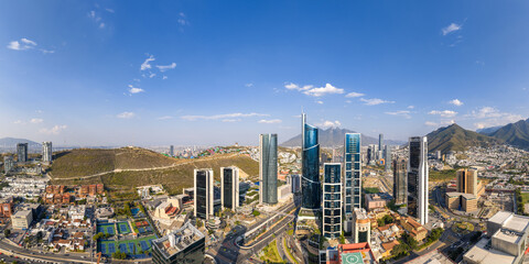 Aerial panoramic view of the San Pedro Garza García skyline with the Cerro de la Silla mountain, Monterrey, Nuevo León, Mexico. © c13studio