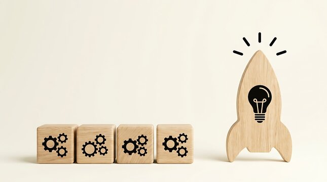 Series of wooden blocks featuring gear mechanism icons placed alongside creative rocket silhouette with illuminated bulb representing conceptual project initiation.