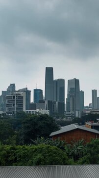 Vertical video - Timelapse of Jakarta ckylines on a cloudy day