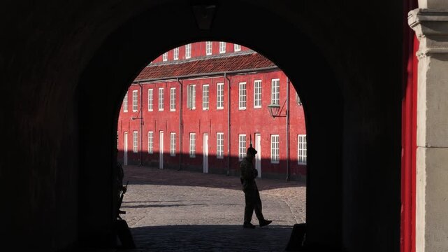 Archway entrance view with guard at Kastellet fortress in Copenhagen, Denmark