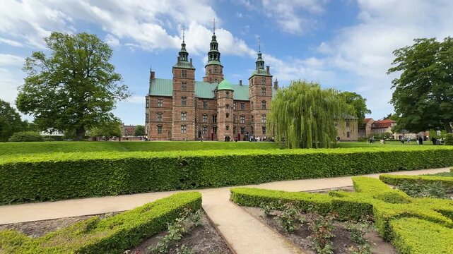 Wide shot of gardens surrounding Rosenborg Castle in Copenhagen city, Denmark