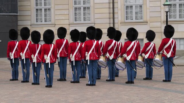 Rear view of Danish royal guard soldiers standing in line in Copenhagen
