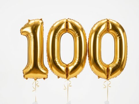 Three Shiny Golden Foil Balloons Forming The Number One Hundred Against White