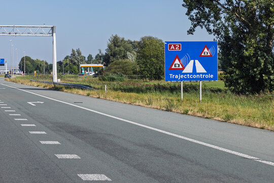 Utrecht, Netherlands. Blue road sign warning drivers of an average speed control camera zone (trajectcontrole) on the A2 highway in the Netherlands.