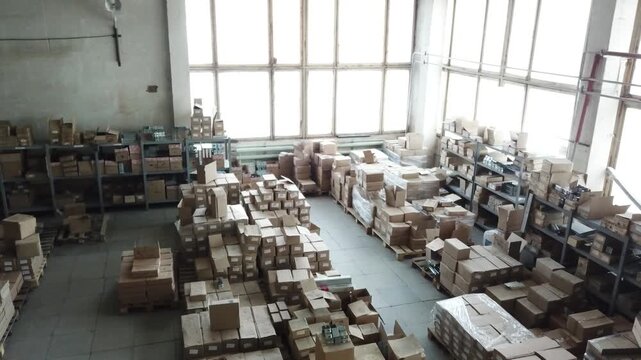 Wide shot of organized boxes on shelves in a warehouse