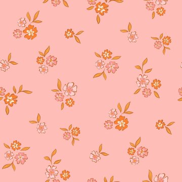Seamless ditsy floral pattern with small colorful blossoms on pastel pink background