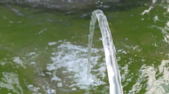 Water Stream Arc Fountain Flowing Splash Nature Close Up Fresh Fluid Motion Green Background