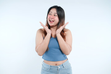 Fototapeta premium Portrait of an excited young Asian woman looking aside in surprise