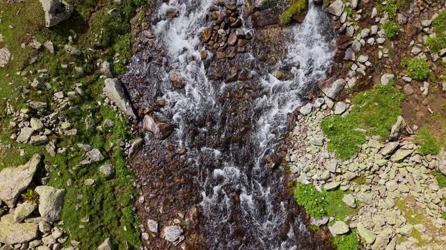 Aerial view of rushing mountain river rapids
