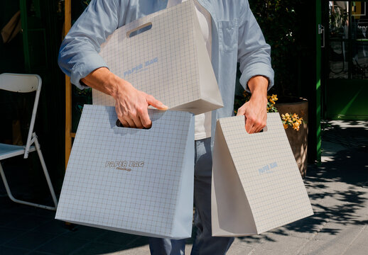 Person with Paper Shopping Bags Mockup