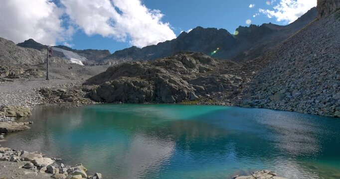  Emerald green lake in the Presena Dolomites.