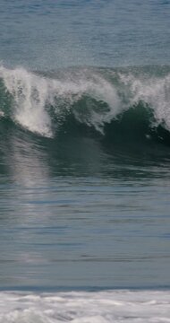 Crashing ocean wave in ocean. Slow motion
