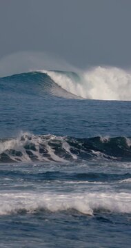 Crashing surfing wave in ocean. Perfect swell waves for surfers. Slow motion