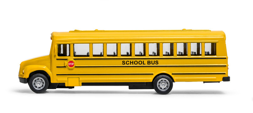 Yellow school bus in side profile on white background, isolated studio view showing windows, wheels